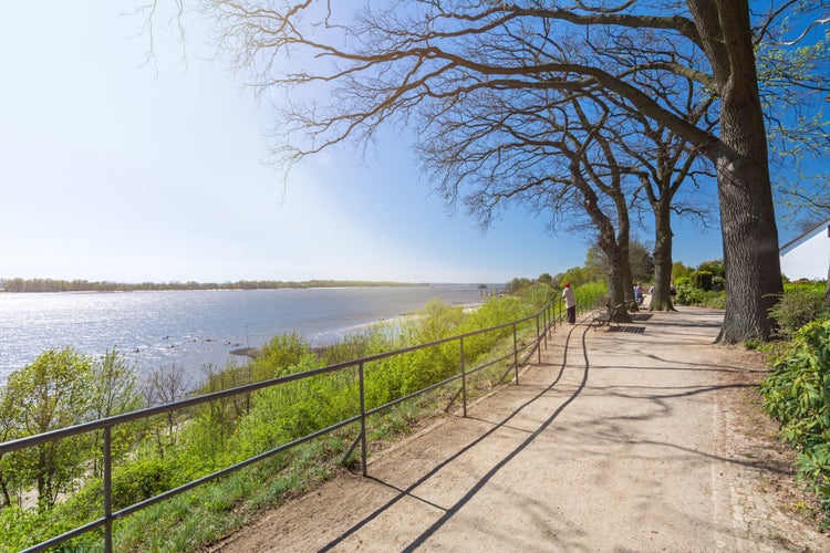 Footpath along the shore of the Elbe river in Wedel, Germany