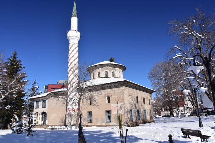 The old mosque in the town of Samokov, Bulgaria. Sunny winter day with white snow and blue sky