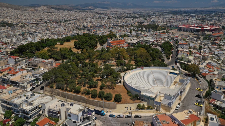 Photo of Aerial drone photo of famous ancient style theater of Veakio above round port of Mikrolimano and Zea, Piraeus, Attica, Greece.