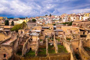 Photo of panoramic view of the ancient town of Matera (Sassi di Matera), European Capital of Culture 2019, in beautiful golden morning light with blue sky and clouds, Basilicata, southern Italy.