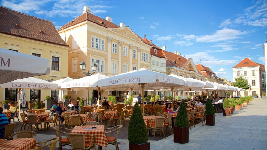 Gyor showing café lifestyle, outdoor eating and signage