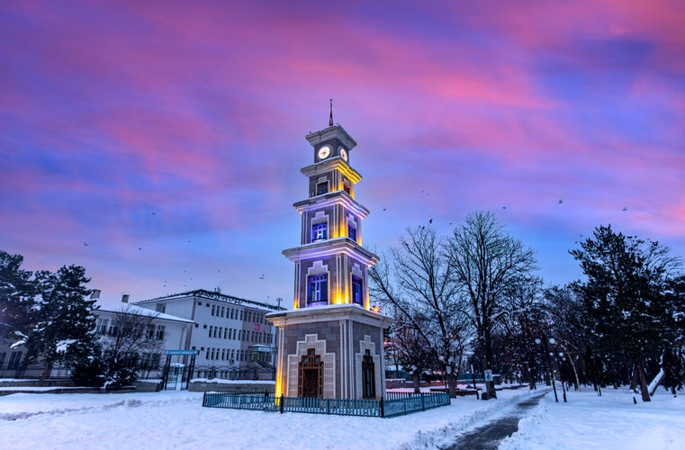 Photo of Clock tower in Erzincan Province snow gold and night exposure, Turkey.