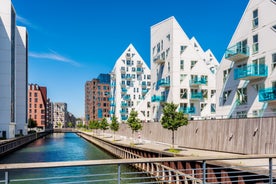 Scenic summer view of Nyhavn pier with color buildings, ships, yachts and other boats in the Old Town of Copenhagen, Denmark