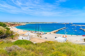 Photo of aerial view of beautiful lighthouse located on high cliffs of Saint Vincent cape in Sagres, Algarve, Portugal.