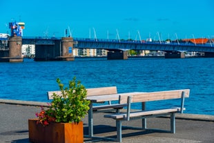 Scenic summer view of Nyhavn pier with color buildings, ships, yachts and other boats in the Old Town of Copenhagen, Denmark