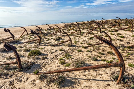 Cemetery of anchors on the beach at Praia Do Barril in Santa Luzia, Algarve, Portugal, Europe