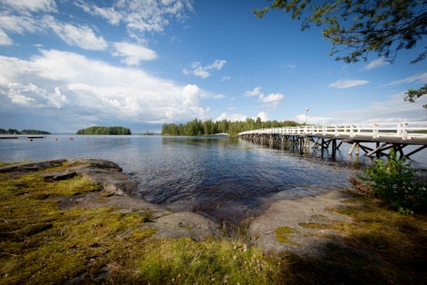 Photo of Long wooden bridge to Sulosaari in Savonlinna Finland .