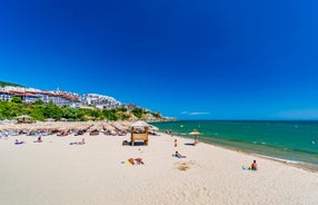 Photo of panoramic aerial view over small ancient resort town of Pomorie with old European small houses , Bulgaria.