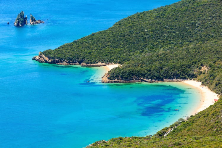 Photo of Summer sea coastal landscape (with sandy beach) of Nature Park Arrabida in Setubal, Portugal.