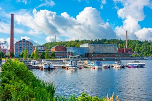 Early autumn morning panorama of the Port of Turku, Finland, with Turku Castle at background.