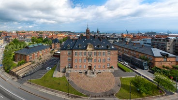 Photo of the harbour of Esbjerg, historical water tower in the background, Jutland, Denmark.