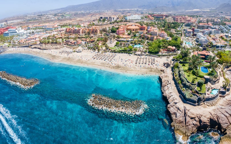 photo of aerial view with El Duque beach at Costa Adeje, Tenerife, Canary Islands, Spain.