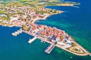 Photo of aerial view of town of Rovinj historic peninsula , famous tourist destination in Istria region of Croatia.