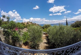 Photo of aerial view of Malia beach and small island with Church of Transfiguration, Heraklion, Crete, Greece.