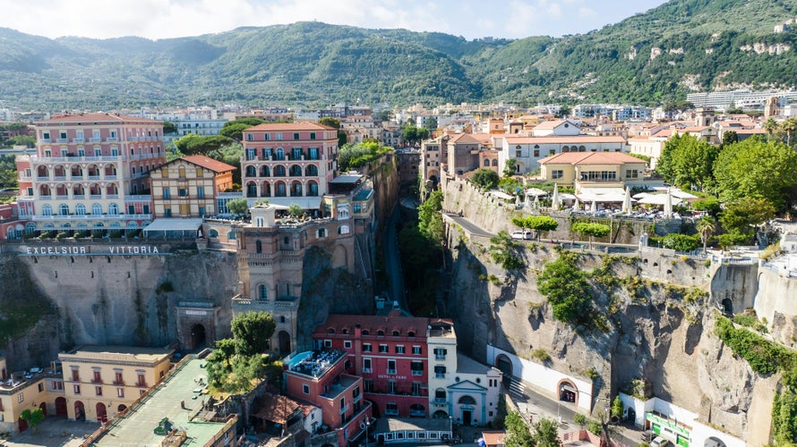 Brown and White Concrete Building on Mountain Cliff Sorrento Italy.jpg