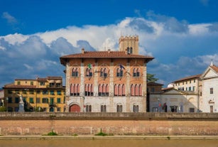 Photo of Italy Piazza Maggiore in Bologna old town tower of town hall with big clock and blue sky on background, antique buildings terracotta galleries.