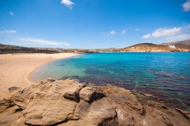 Photo of panoramic aerial view of the popular Platis Gialos beach on the Greek island of Mykonos with turquoise sea, Greece.