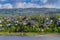 Photo of landscape with mountains, river and buildings in Lillehammer town, Norway.