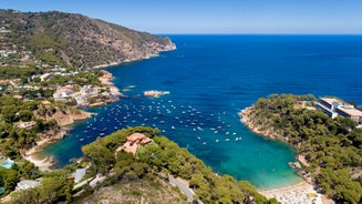 photo of sea landscape with Calella de Palafrugell, Catalonia, Spain near of Barcelona. Scenic fisherman village with nice sand beach and clear blue water in nice bay. Famous tourist destination in Costa Brava.