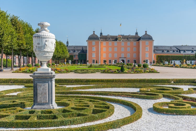  Photo of Schwetzingen palace in Germany viewed from a blossoming garden