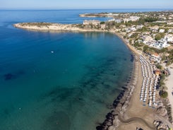 Photo of aerial view on clear blue water of Coral bay in Peyia, Cyprus.