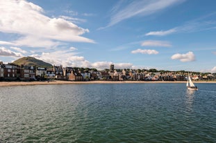 photo of sailing boat off North Berwick, East Lothian, Scotland. Includes a view of the town and North Berwick Law.