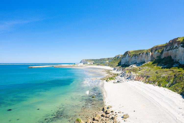 Photo of The verdant Norman Cliffs above the white pebble beach in Europe, France