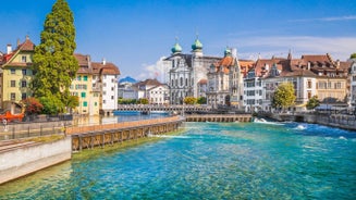 Panoramic view of historic Zurich city center with famous Fraumunster, Grossmunster and St. Peter and river Limmat at Lake Zurich on a sunny day with clouds in summer, Canton of Zurich, Switzerland