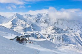 Photo of The mountain village at the Austrian ski resort Soelden on a cold and sunny winter day.