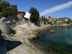 Photo of panoramic aerial view over small ancient resort town of Pomorie with old European small houses , Bulgaria.