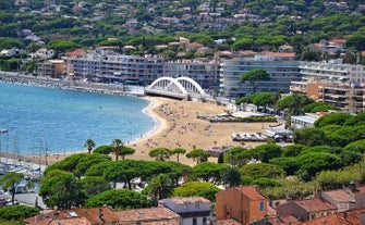 Photo of aerial cityscape view on French riviera with yachts in Cannes city, France.