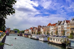 Amsterdam Netherlands dancing houses over river Amstel landmark in old european city spring landscape.