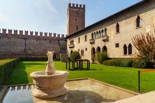 Photo of beautiful view of canal with statues on square Prato della Valle and Basilica Santa Giustina in Padova (Padua), Veneto, Italy.