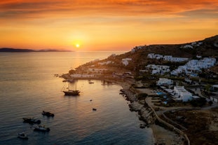 Photo of beautifull view over Mykonos from the sky with drone at the whitewashed village Greece.