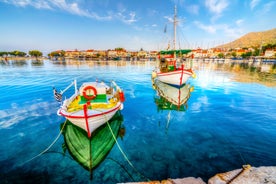 Photo of aerial view of Pythagorio port with colourful houses and blue sea, Samos island, Greece.