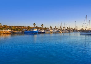 photo of aerial panoramic drone point of view Cabo Roig coastline with blue Mediterranean Seascape view, residential buildings near sandy beach at sunny summer day. Province of Alicante, Costa Blanca. Spain.