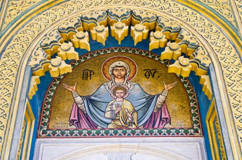 Photo of decorated door of the church in Curtea de Arges, Romania.
