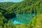 Kozjak lake with ferry boats overlook on Plitvice Lakes National Park of Croatia. Natural forest park with lakes and waterfalls in Lika region. UNESCO World Heritage of Croatia named Plitvicka Jezera