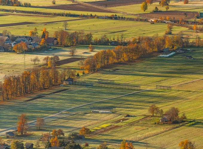 Photo of View of the valley, towns and meadows at sunrise .