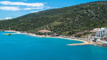 photo of a beautiful panoramic view of Kastel Luksic harbor and landmarks summer view, Split region of Dalmatia, Croatia.