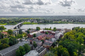 Photo of aerial view of The Ogre River, Bridges and Houses in the Autumn Time, Ogre, Latvia.