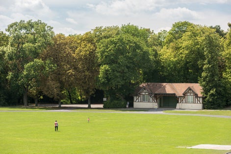 photo of Parc de Champagne with people enjoying the beautiful view in Reims, France.