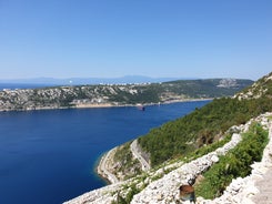 photo of aerial panoramic view of beautiful town of Lovran and sea walkway in Croatia.