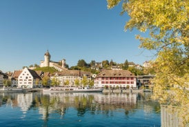 View of the Old Town of Basel with red stone Munster cathedral and the Rhine river, Switzerland.