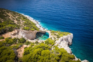 Photo of Heraion in Perachora with small beach, Loutraki, Greece.