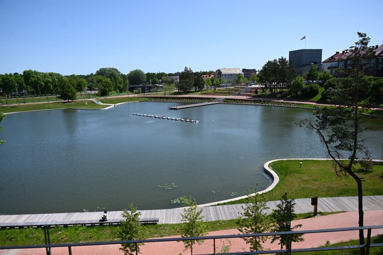 Photo of a pond in the center of the city and a city park located next to it, Panevėžys, Lithuania.