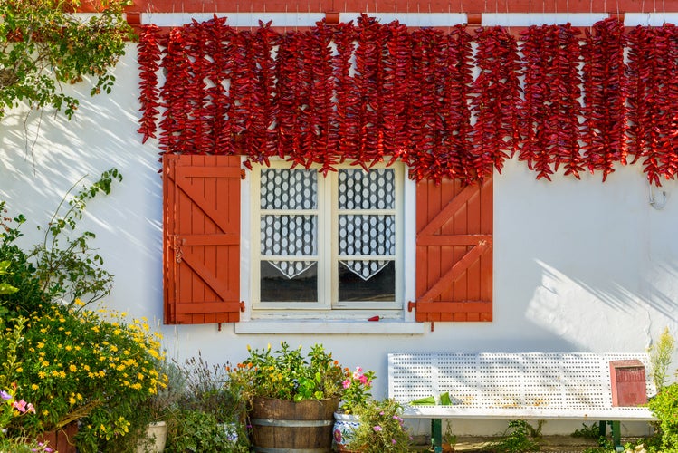 Espelette chilli peppers drying outside a traditional Basque house in Espelette, France.jpg