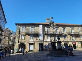 Photo of Facade of Santiago de Compostela cathedral in Obradoiro square, Spain.