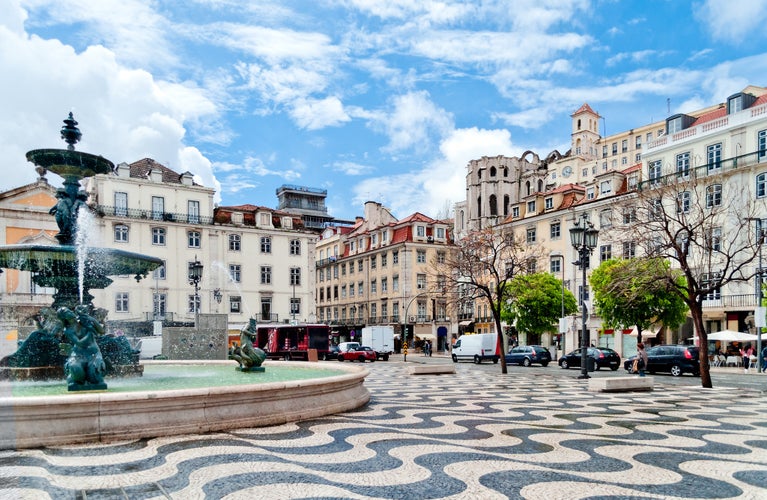 Photo of Rossio square with fountain located at Baixa district in Lisbon, Portugal.