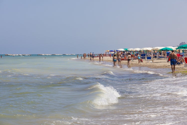 Beach with bathers in the summer in the adriatic sea in Italy, San Benedetto del Tronto .